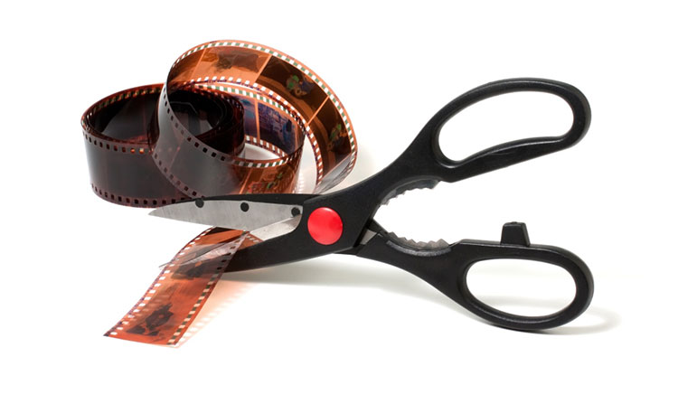 Use of scissors and tape to trim unnecessary footage